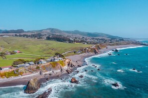 Enjoy breathtaking views of the ocean and surrounding landscape from the expansive porch area.