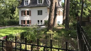 A two-story house with a white exterior, brick accents, and a dark roof. - Villa Waldglück near Rangsdorfer See (Rangsdorf)