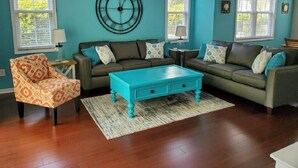 A living room with two sofas, a coffee table, and patterned chairs. - Quick Walk to the Beach!! (North Myrtle Beach)