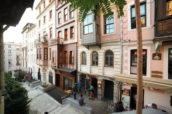 A multi-story building with a ground-floor café and a visible restaurant. - Medar Hotel (Istanbul)