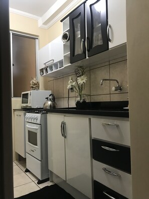 Fridge, microwave, toaster, cookware/dishes/utensils