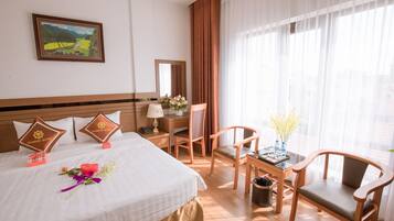 Honeymoon Room, City View | Minibar, in-room safe, desk, blackout drapes