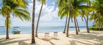 Kaibo Yacht Club 12C - 2nd floor condo with beach views - call Cayman Villas!