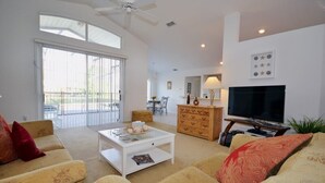 Family Villa, Garden Area | Living room | Flat-screen TV, video game console - Ffv8455ha - Southern Dunes - 3 Bed 2 Baths Villa (Haines City)