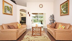 Family Villa, Garden Area | Living room | Flat-screen TV, video game console - Ffv8466ha - Greater Groves - 4 Bed 3 Baths Villa (Clermont)