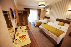 Standard Triple Room | Desk, blackout curtains, soundproofing, iron/ironing board