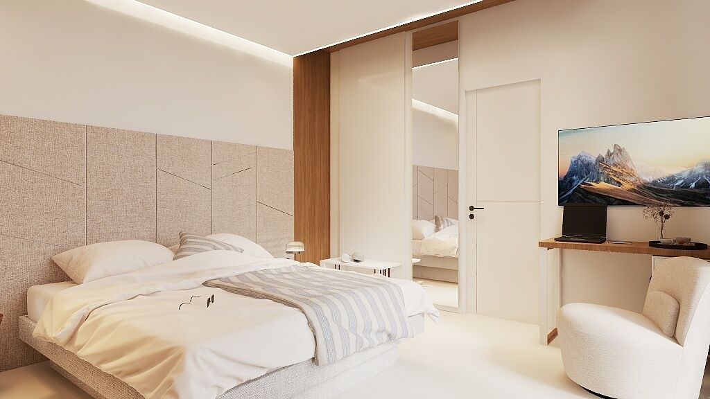 Un dormitorio moderno con cama, mesitas de noche, una silla y televisor.