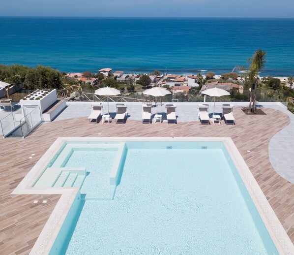 Seasonal outdoor pool, pool umbrellas, pool loungers