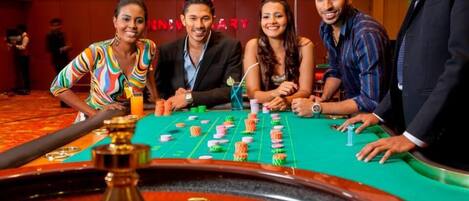 A roulette table at Bally's Casino with a visible betting layout and a roulette wheel.
