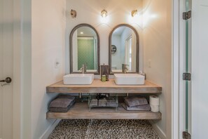 A bathroom with two sinks, a mirror, and a towel rack. - Points End (Mooresville)