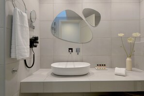 Eco-friendly toiletries, hair dryer, towels, toilet paper