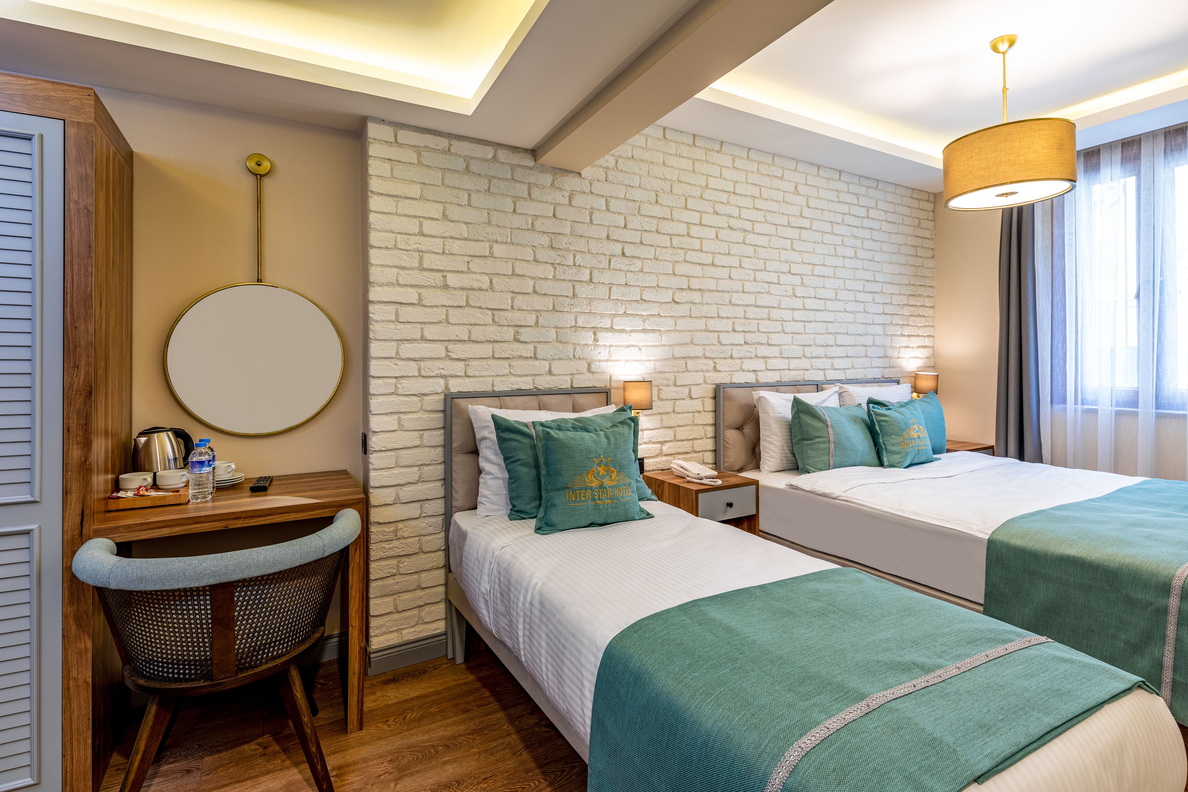 economy triple room, ground floor | minibar, in-room safe, blackout curtains, soundproofing