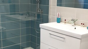 A modern bathroom with a glass shower enclosure, a white vanity with a mirror, and a small window above the mirror. - PORTICCIO QUIET AND CLIMATE VILLA 5 MIN FROM FOOT OF AGOSTA BEACH (Albitreccia)