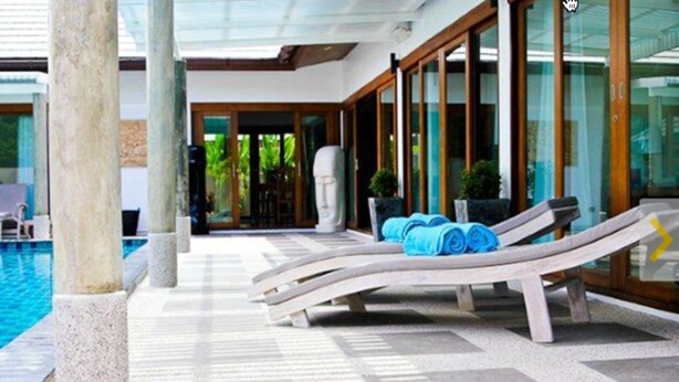A poolside area with lounge chairs and a statue. - 3 Bedroom Villa - just 3 minutes walk to the beach SDV033-By Samui Dream Villas (Koh Samui)