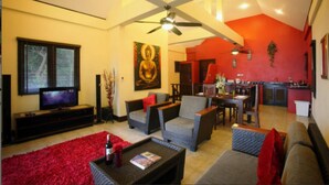 A living room with a television, sofas, a coffee table, and a red rug. - 6 Bedroom Bay & Island View Twin Villa Koh Phangan SDV233/234-By Samui Dream Villas  (Ko Pha-ngan)