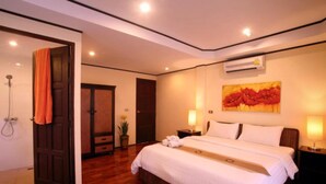 A hotel room with a large bed, a shower area, and a painting on the wall. - 6 Bedroom Bay & Island View Twin Villa Koh Phangan SDV233/234-By Samui Dream Villas  (Ko Pha-ngan)