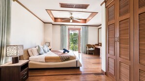 A bedroom with a bed, bedside table, and a view of the outdoors. - 7 Bedroom Twin Villas TG48+TG25 on Beach Front Resort SDV282/288-By Samui Dream Villas (Koh Samui)