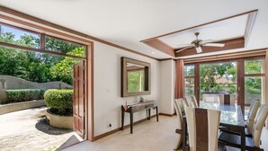 A spacious dining area with a large table and chairs, a ceiling fan, and a view of the outdoors. - 7 Bedroom Twin Villas TG48+TG25 on Beach Front Resort SDV282/288-By Samui Dream Villas (Koh Samui)