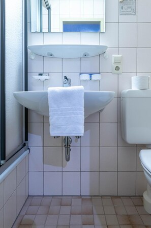 Shower, towels, toilet paper