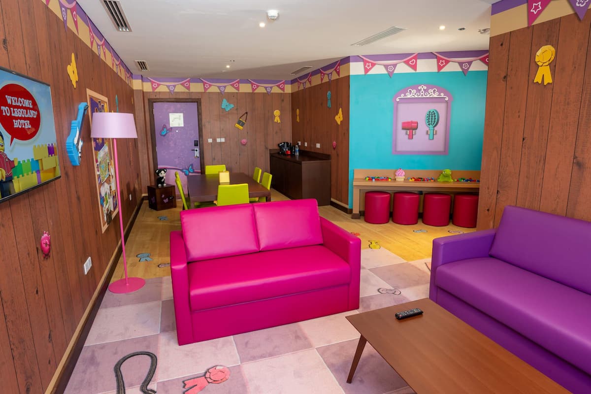 lego® friends fully themed family suite with park access | living area | smart tv