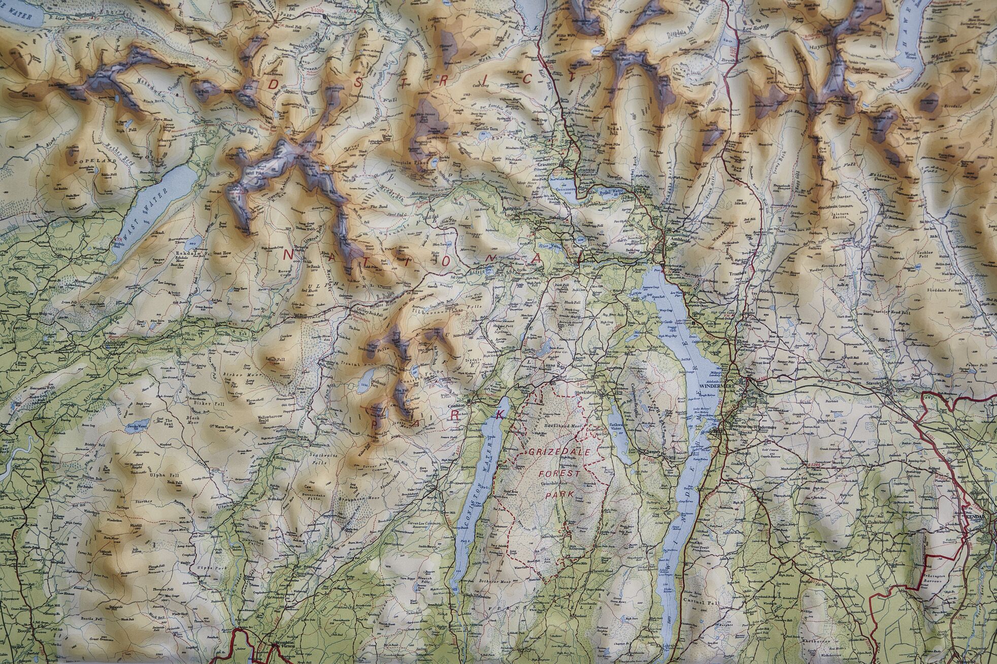 A detailed topographic map with marked trails, water bodies, and elevation contours.