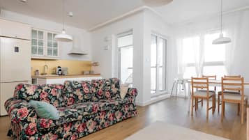 Comfort Apartment | Living room | 30-inch flat-screen TV with satellite channels, TV