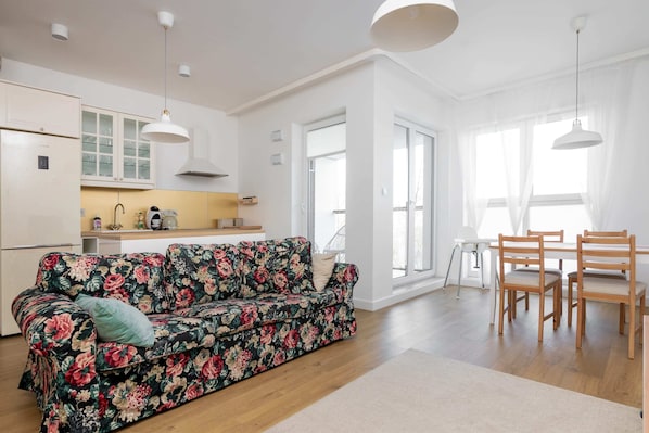 Comfort Apartment | Living room | 30-inch flat-screen TV with satellite channels, TV