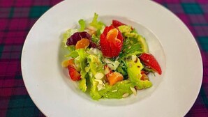 A white plate with a salad on a checkered tablecloth. - The Kings Arms Hotel (Castle Douglas)