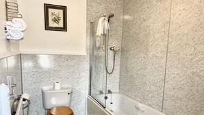 A modern bathroom with a toilet, sink, and bathtub. - The Kings Arms Hotel (Castle Douglas)