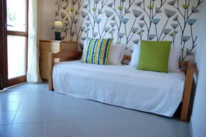 Family Triple Room | Individually decorated, individually furnished, desk, laptop workspace - Hotel Galman (Carloforte)