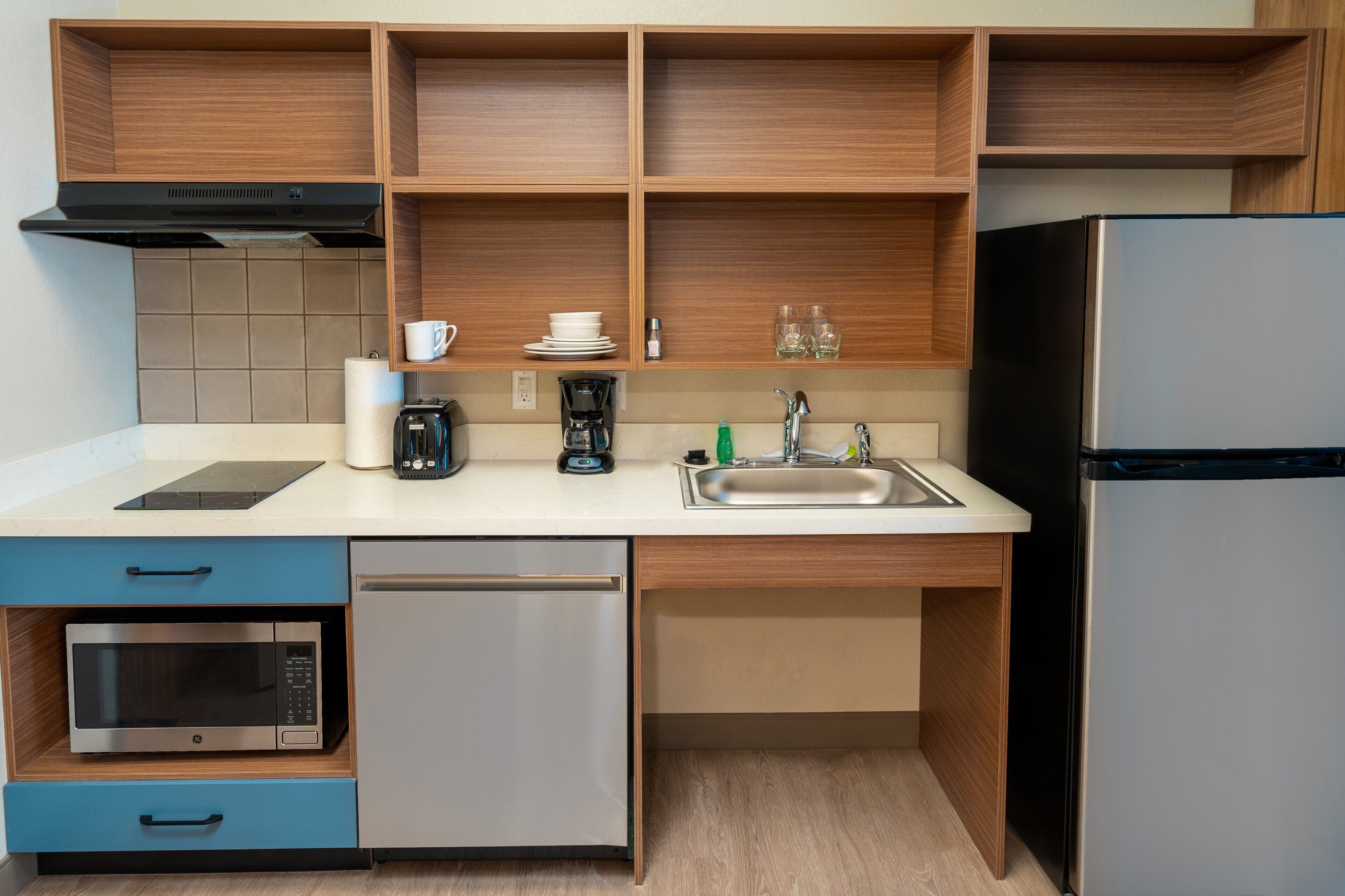 full-sized fridge, microwave, stovetop, dishwasher