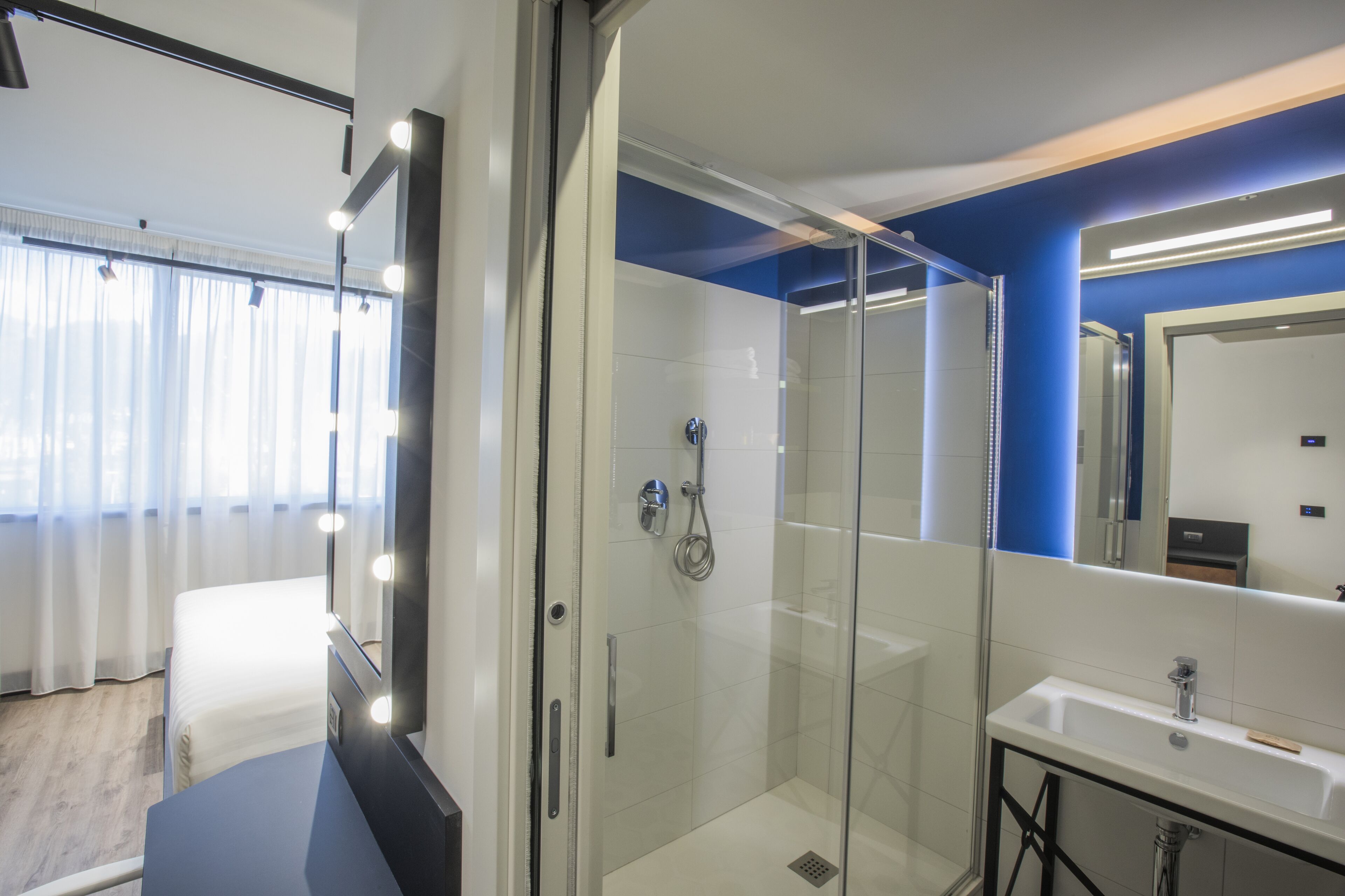 superior double or twin room, balcony | bathroom | shower, rainfall showerhead, eco-friendly toiletries, hair dryer