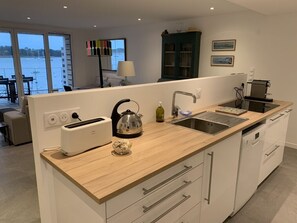Coffee/tea maker, fridge, microwave, oven