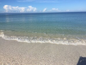 On the beach, sun-loungers, beach umbrellas, beach towels