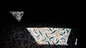 A patterned fabric with floral designs and a geometric pattern.