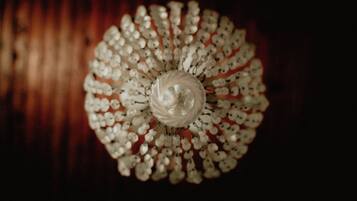 A chandelier with multiple light bulbs arranged in a circular pattern.