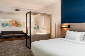 Premium bedding, desk, laptop workspace, blackout drapes