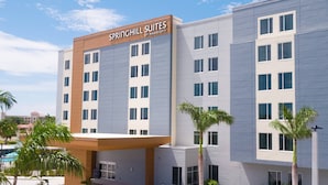 A modern hotel with a flat roof, multiple windows, and a sign reading "SPRINGHILL SUITES BY MARRIOTT". - SpringHill Suites by Marriott Cape Canaveral Cocoa Beach (Cape Canaveral)