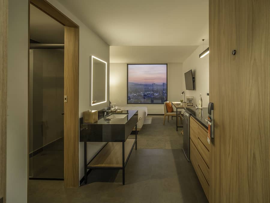 Shower, designer toiletries, hair dryer, towels