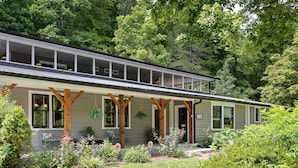 A single-story house with a porch, wooden beams, and a number 7330 on the door. - Lyric Retreat at GratiDude Ranch - Sleeps 23 with Pool in Leiper's Fork (Franklin)