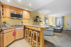 Apartment, 1 King Bed with Sofa bed | Private kitchen | Full-sized fridge, microwave, stovetop, dishwasher