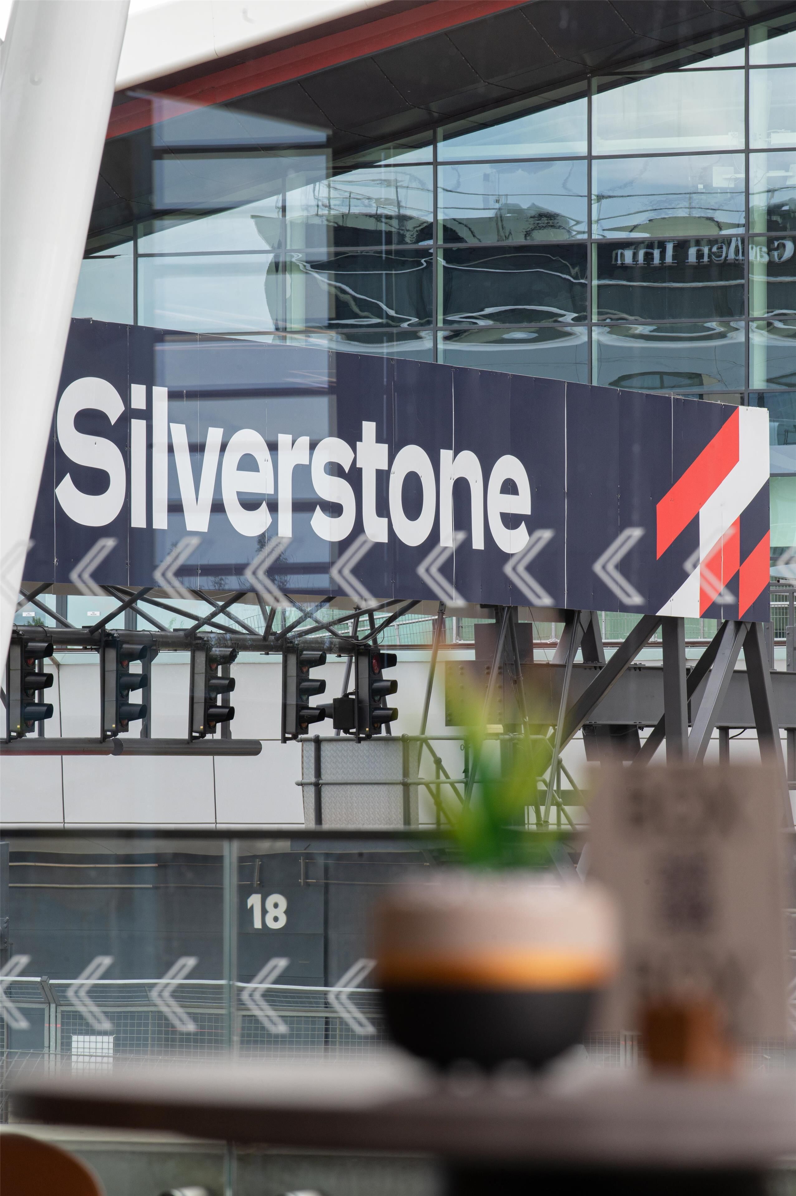 A building with a large sign reading 'Silverstone' and a number '18' on the wall.