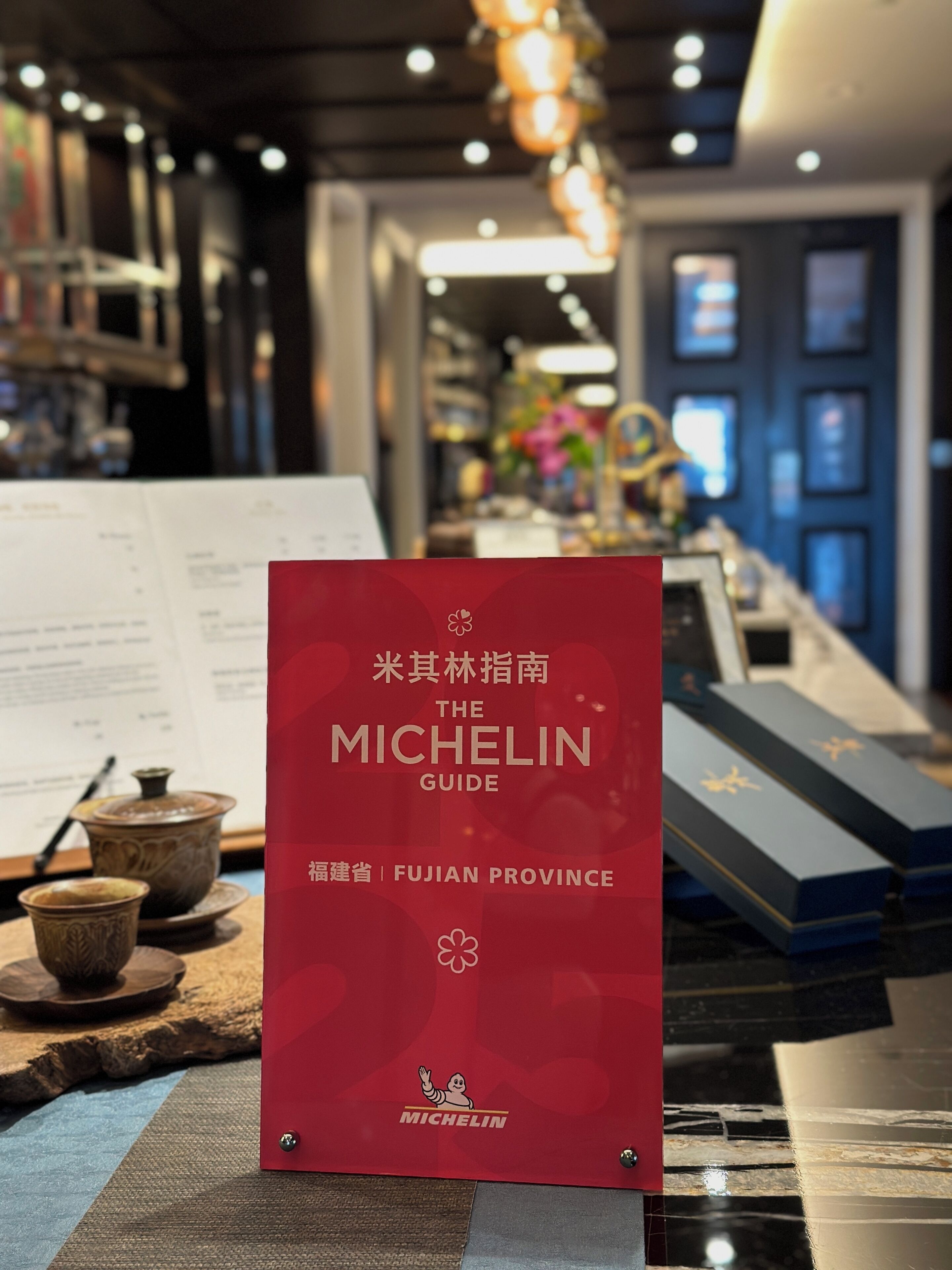 A red guidebook titled "The Michelin Guide" for Fujian Province.