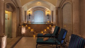 A spa area with a mosaic wall, two lounge chairs, and a small pool. - Pueblo Bonito Sunset Resort, Cabo San Lucas, Mexico (Cabo San Lucas)