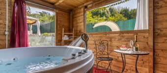 Detached villa with outdoor hot tub, swimming pool and lawn 