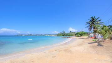 On the beach, sun-loungers, beach towels