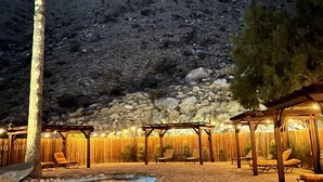 A patio with outdoor seating, a pool, and a mountain backdrop. - LAZY C RANCH - POOL, ANIMALS, DESERT RANCH EXPERIENCE (Palm Springs)