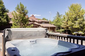 A hot tub with a clear view of surrounding buildings and trees. - Iconic Sedona House | Walk to Uptown + Hot Tub, The Sedona House ~ Red Rock Getaway (Sedona)