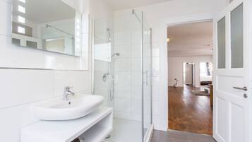 Shower, hair dryer, towels, soap