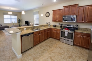 House (7 Bedrooms, 5 Bathrooms) | Private kitchen | Full-sized fridge, microwave, oven, stovetop - Sunrise Station by VillaDirect (Davenport)